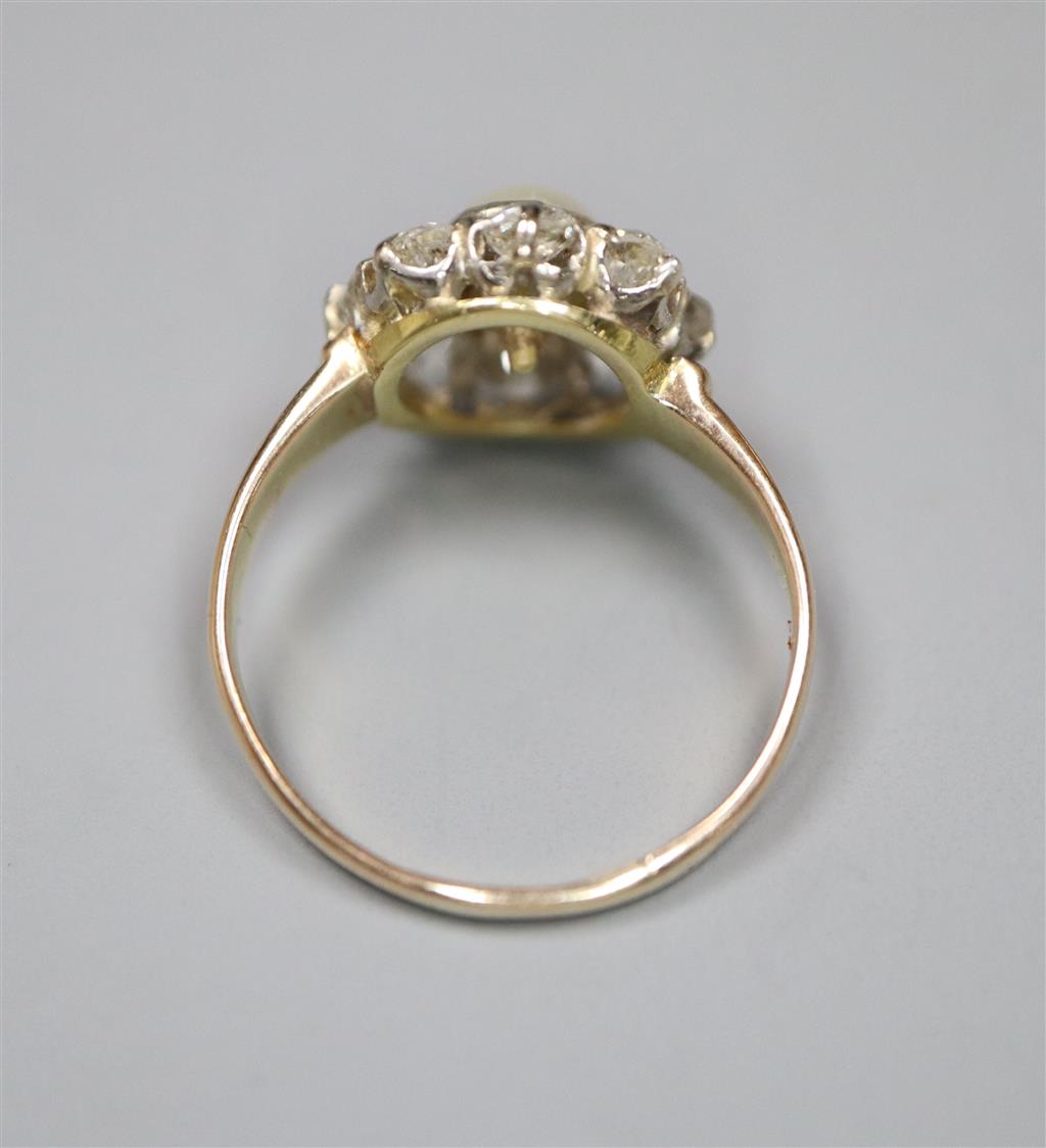 A yellow metal, cultured pearl and diamond set flower head cluster ring, size L, gross 3.1 grams,